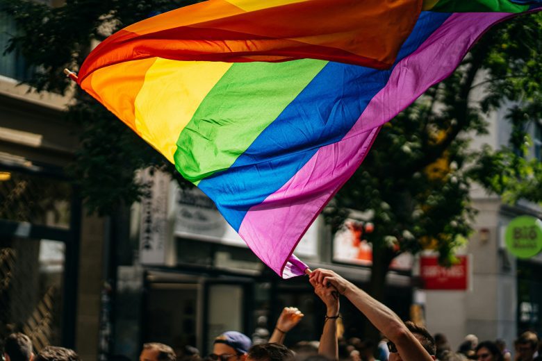 rainbow flag waving a pride march